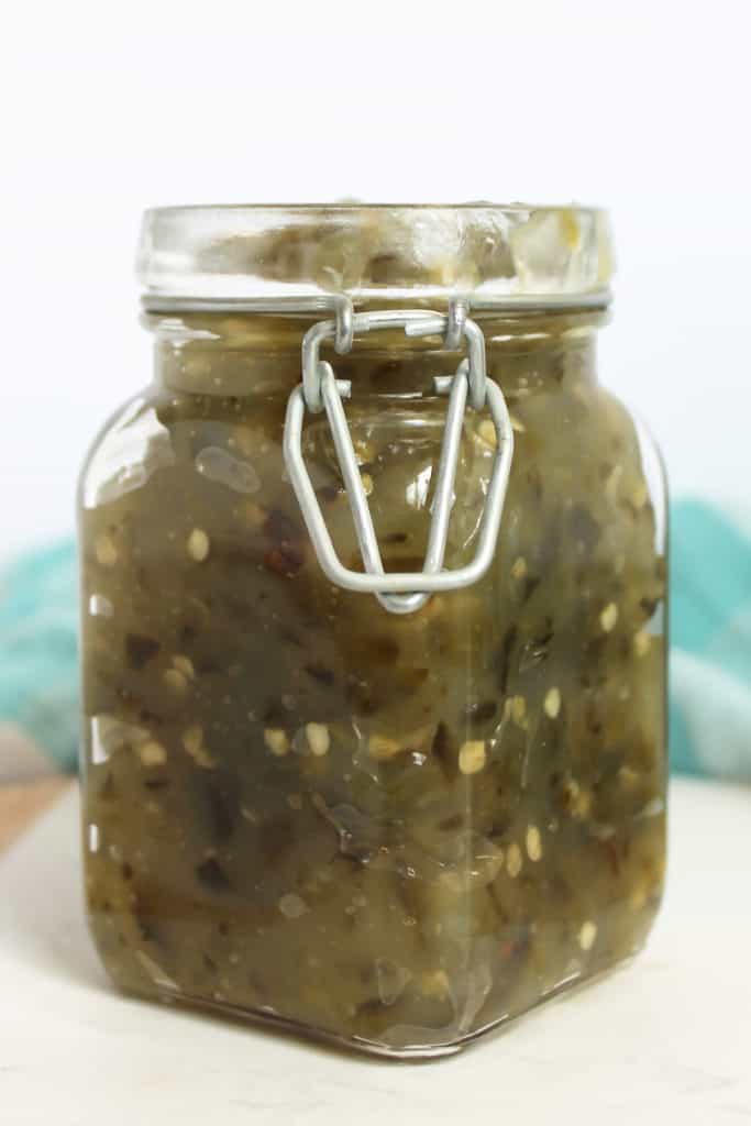 Jalapeno jelly in a square glass jar