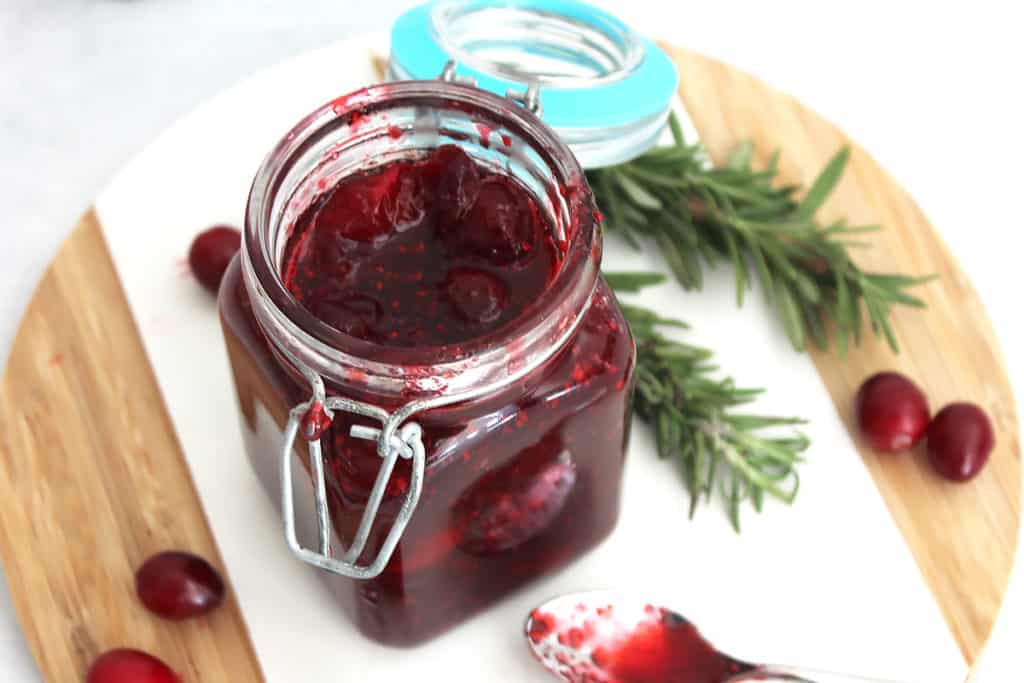 The cranberry brown sugar sauce in a small glass jar.