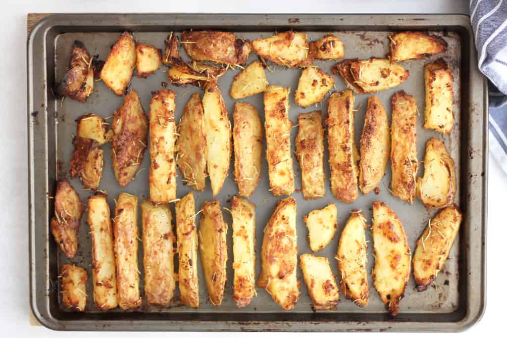 The baked fries on a baking sheet ready to serve.