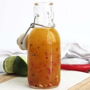 Chili lime dressing in a glass bottle.