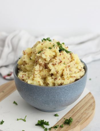Mustard mashed potatoes served in a bowl ready to eat.