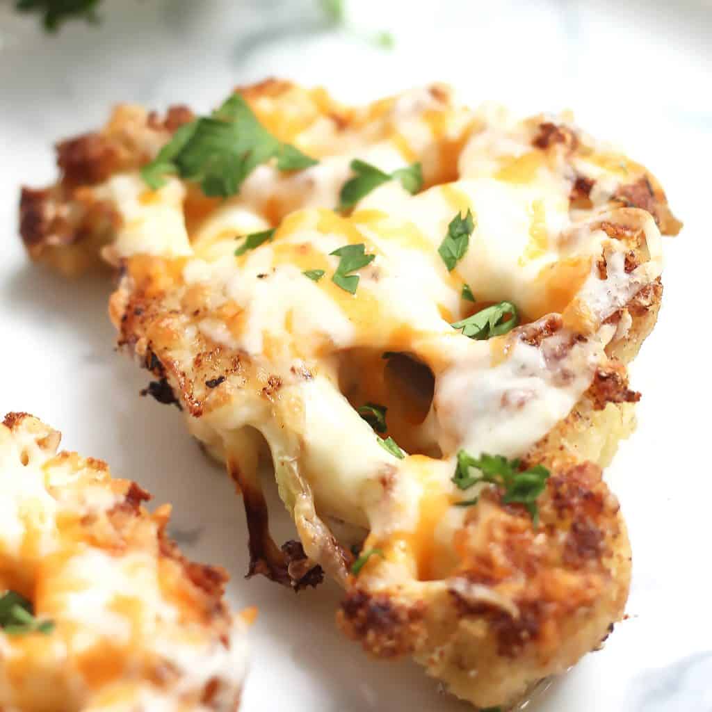 Cheesy Oven Roasted Cauliflower Steaks Bite On The Side
