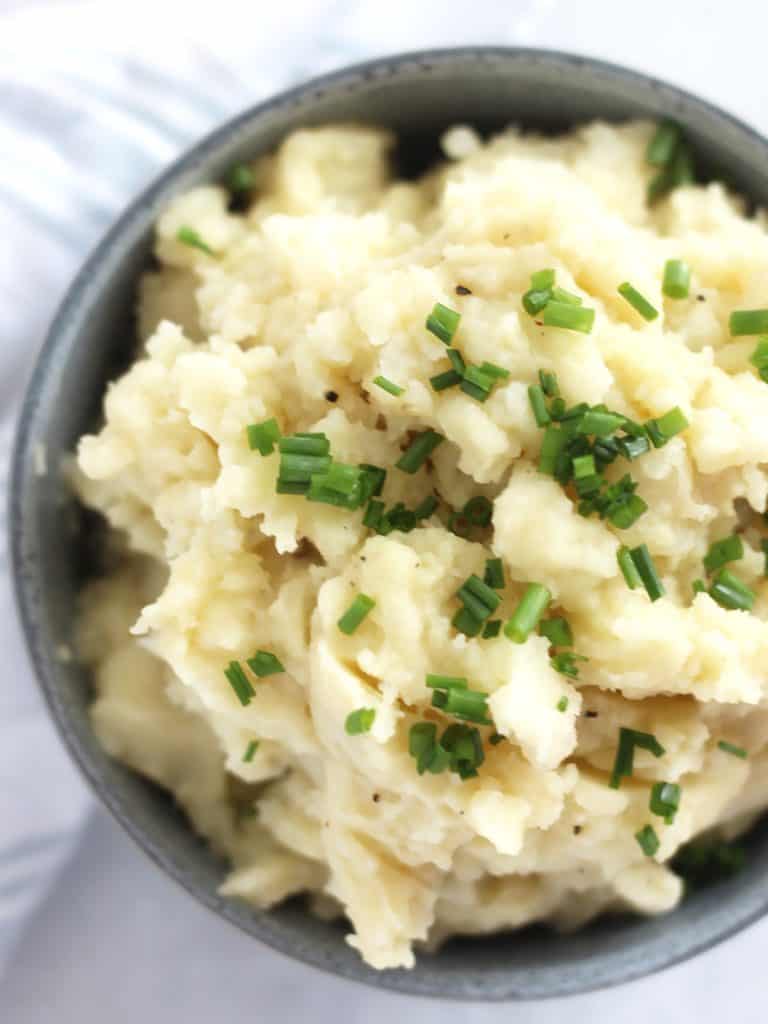 Overhead close up of potato mash in a bowl.