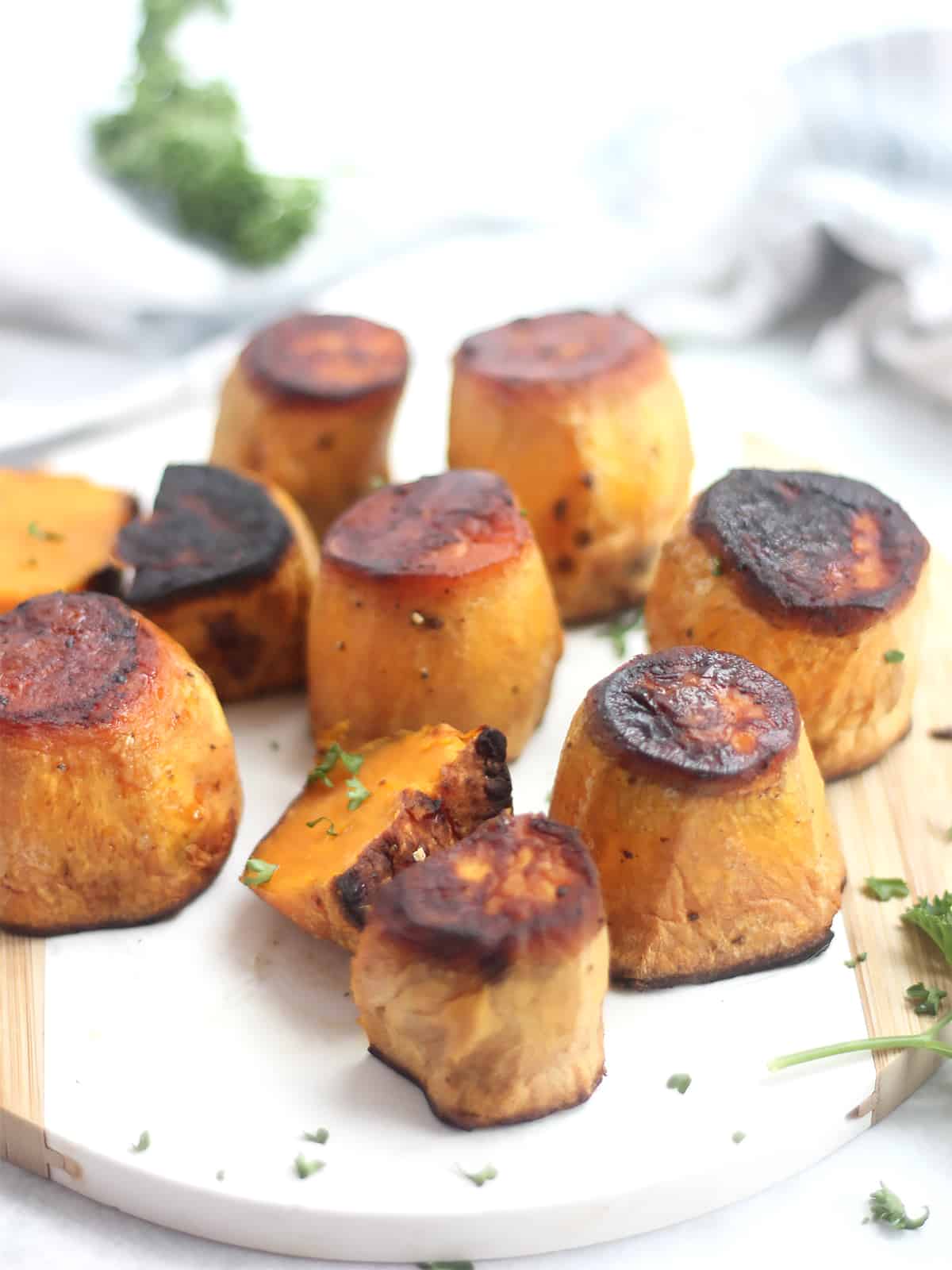 Eight fondant sweet potatoes with two cut in half.