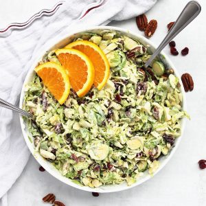Overhead shot of Brussels sprout slaw served in a large bowl.
