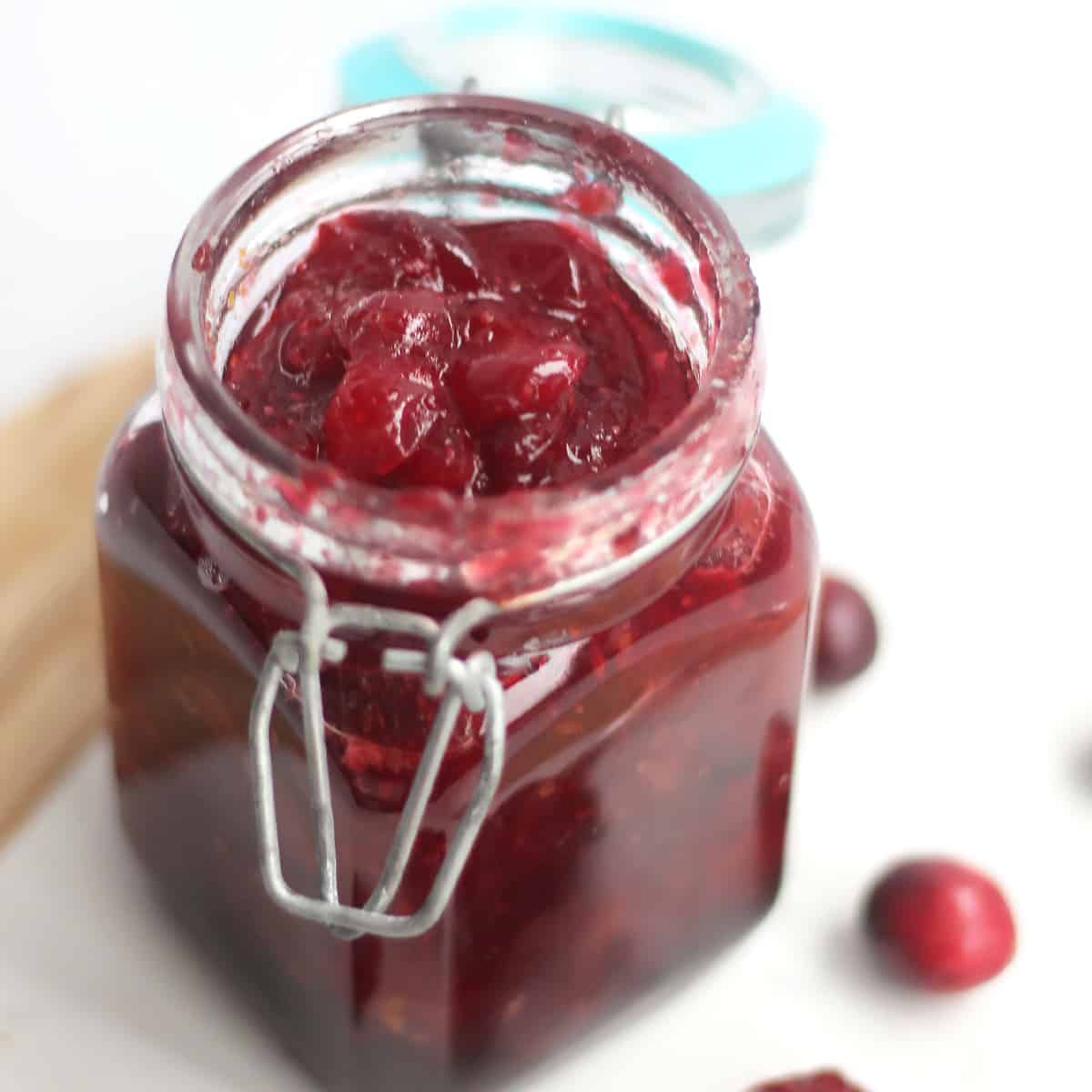 Whiskey cranberry sauce in a small mason jar.