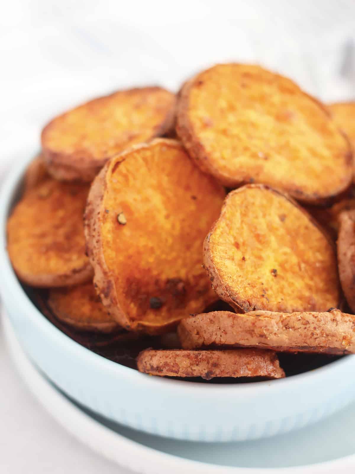 Close up of baked sweet potato rounds.