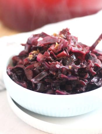 Cooked red cabbage in a bowl with steam coming off of it.