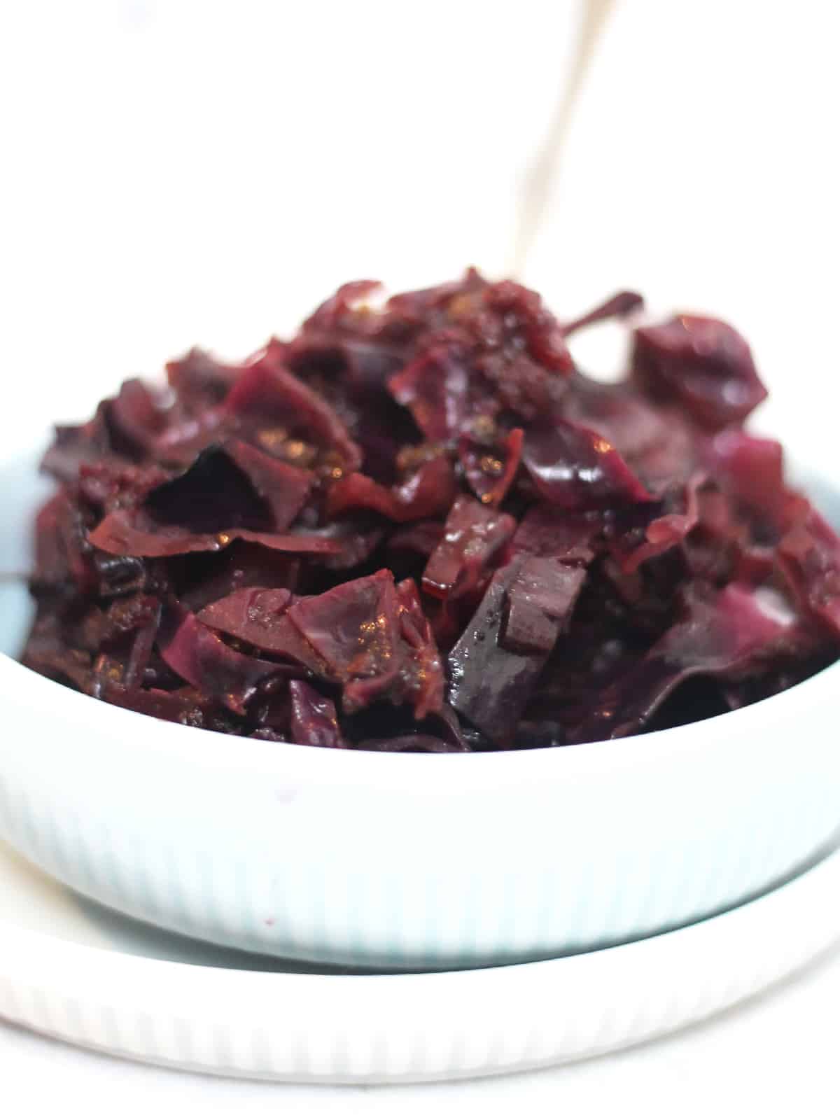 Balsamic braised red cabbage in a bowl with a fork.