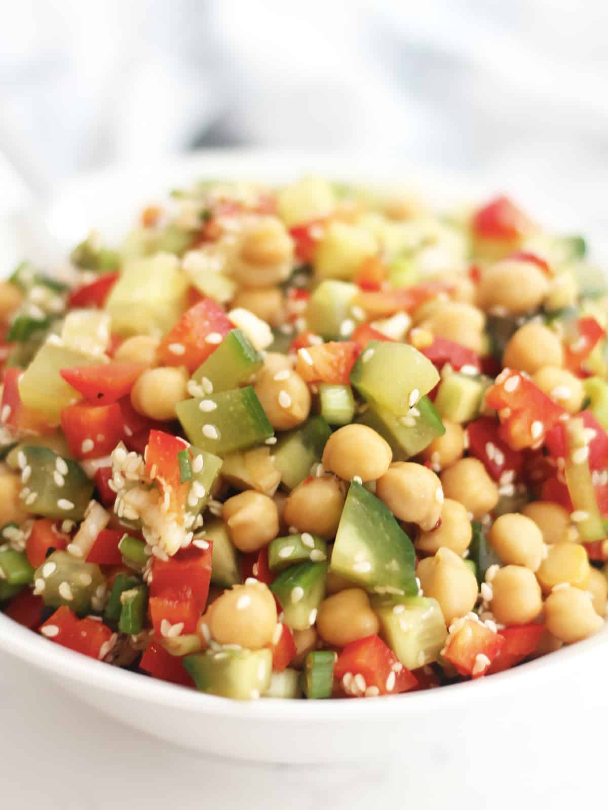 Chickpea and cucumber salad with sesame seeds.