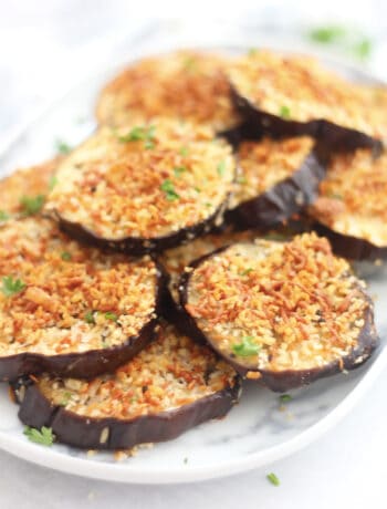 Baked eggplant rounds with a crispy topping.