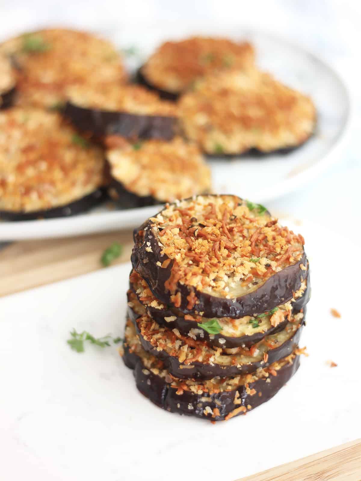 Four eggplant rounds stacked on top of each other.