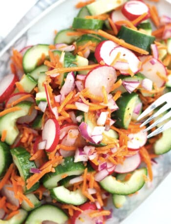 Crunchy and colorful salad on a serving plate.