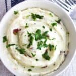 Bacon and blue cheese mashed potato in a bowl.