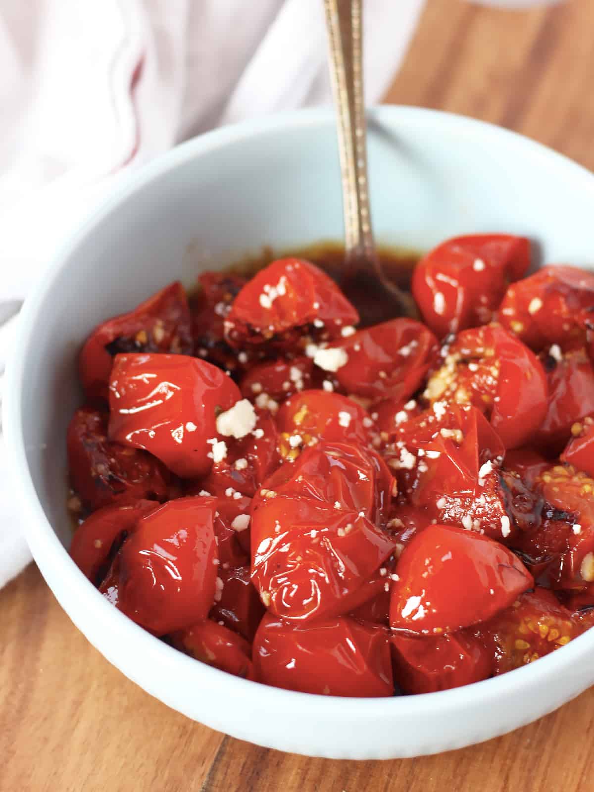Balsamic cherry tomatoes garnished with feta.