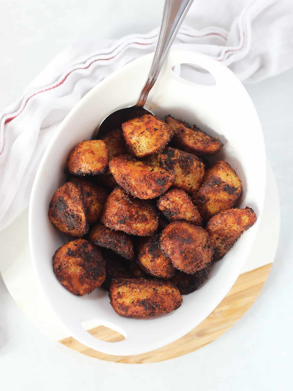 Roasted potatoes seasoned with paprika and cayenne.