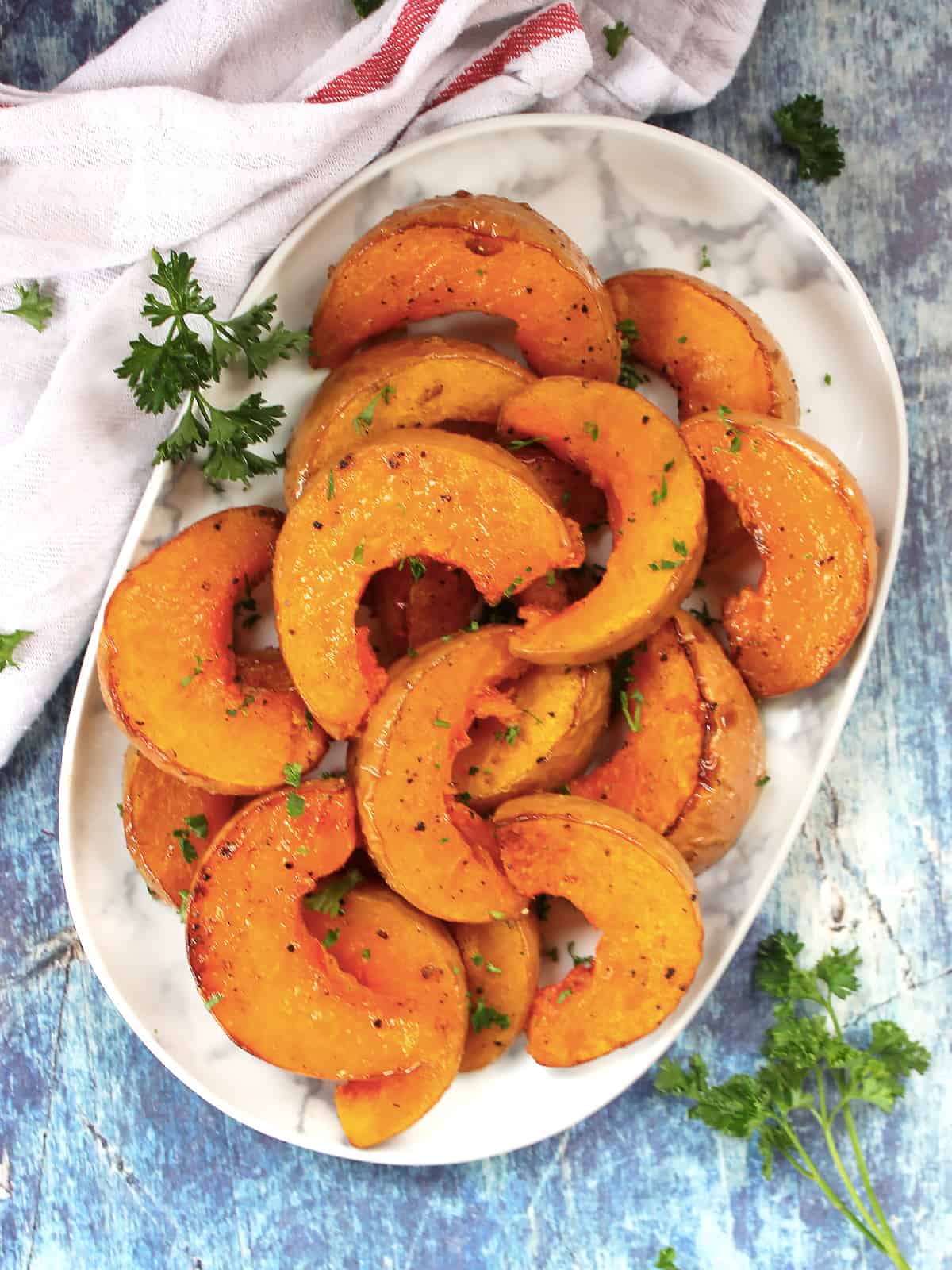 Roasted butterkin squash garnished with fresh parsley.