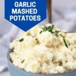 Pinterest graphic. Cheesy garlic mashed potato with text overlay.