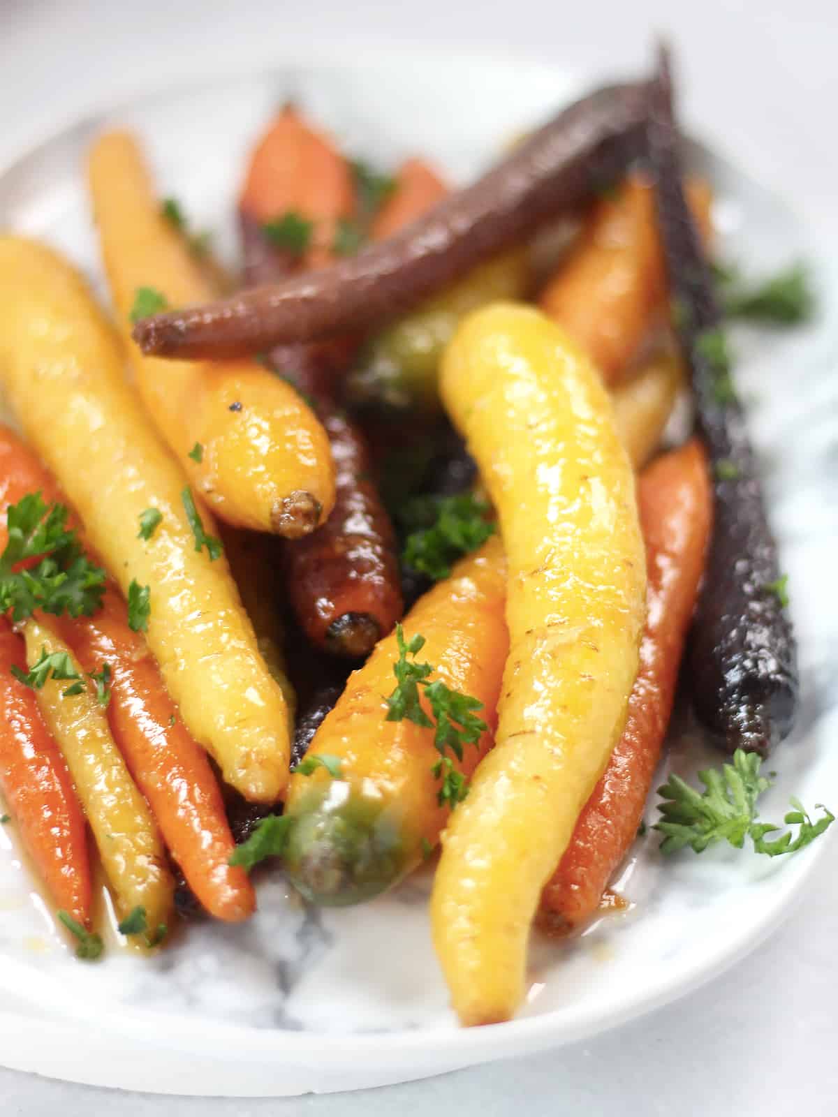 Yellow, red and orange glazed carrots.