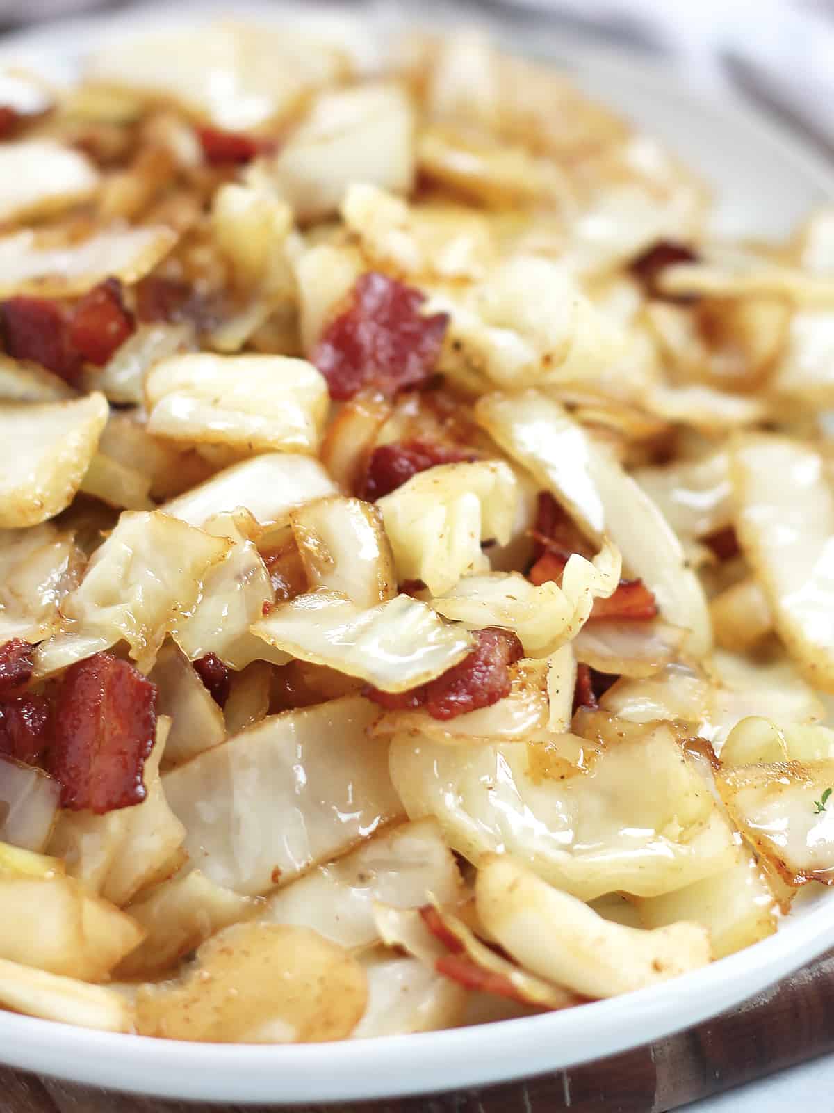 Shredded cabbage and fried bacon.