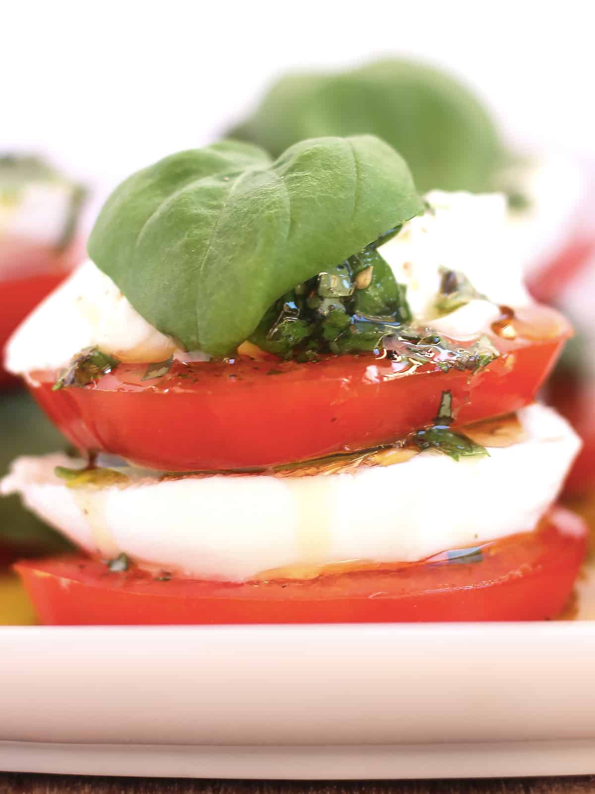 Tomato, mozzarella cheese and fresh basil drizzled with olive oil.