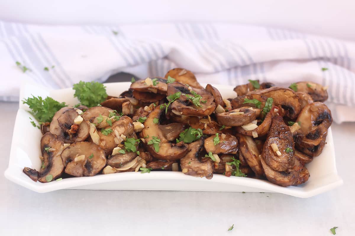 Sliced mushrooms with garlic and parsley.
