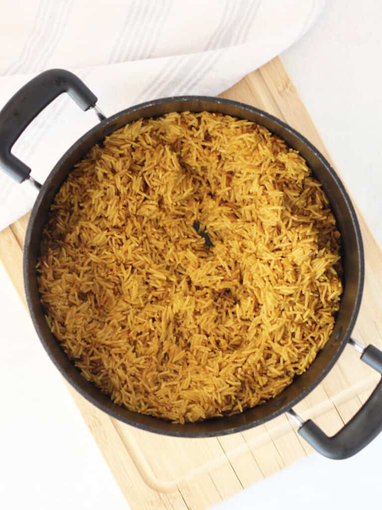 Cooked Egyptian rice in a black pot ready to serve.