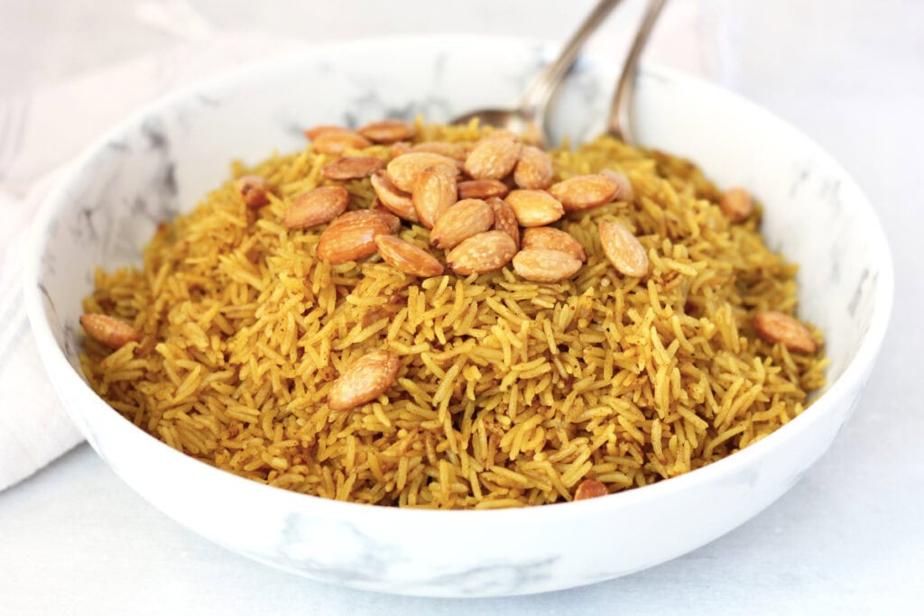 Fried almonds served on top of spiced rice.