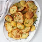 Golden brown sliced potatoes ready to eat.