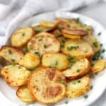 Crispy potato slices on a serving plate.