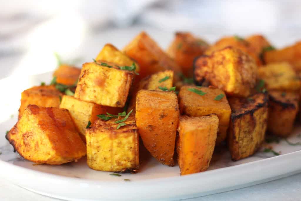 Air fryer roasted butternut squash served on a plate.