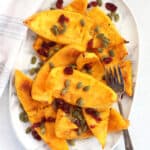 Air fried pumpkin served on a plate with a fork.