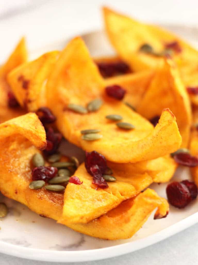 Pumpkin wedges with caramelized edges.