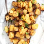 Air fried rutabaga served on a plate with a serving fork.