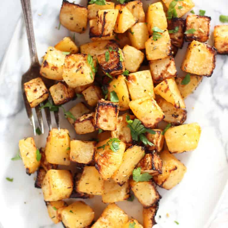 Cubes of air fryer roasted rutabaga served on a plate.