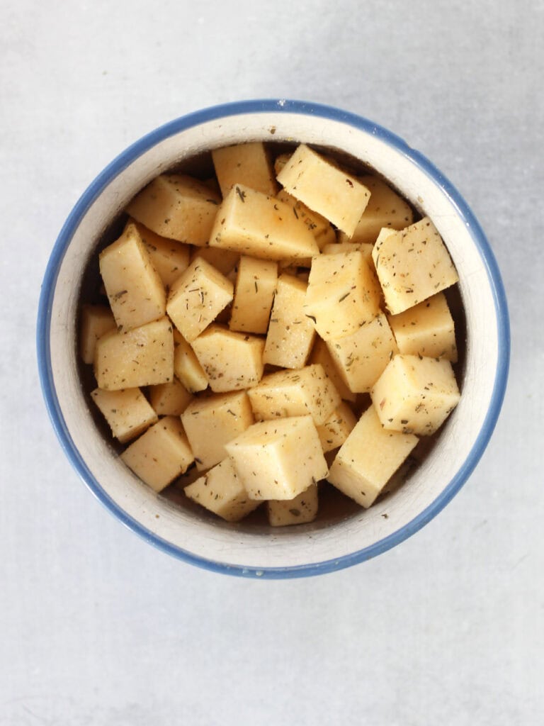 Rutabaga seasoned in a bowl.