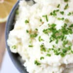 Chive garnish on top of lemon mashed potatoes.
