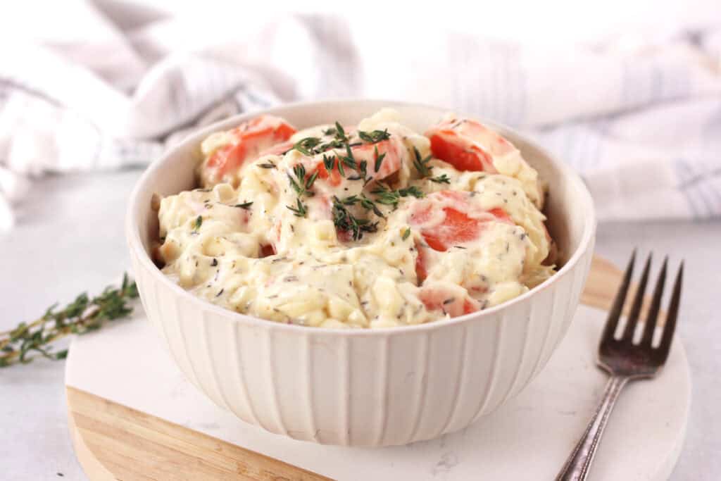 Creamed carrots served in a white bowl.
