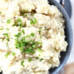 Fresh chives sprinkled on top of mashed potatoes.