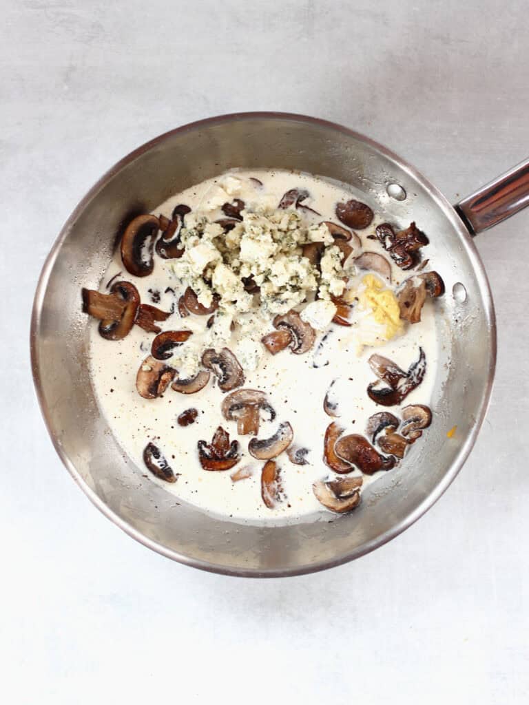 Cream, blue cheese and Dijon mustard added to the cooked mushrooms.