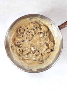 Cooked mushrooms in a cream sauce.