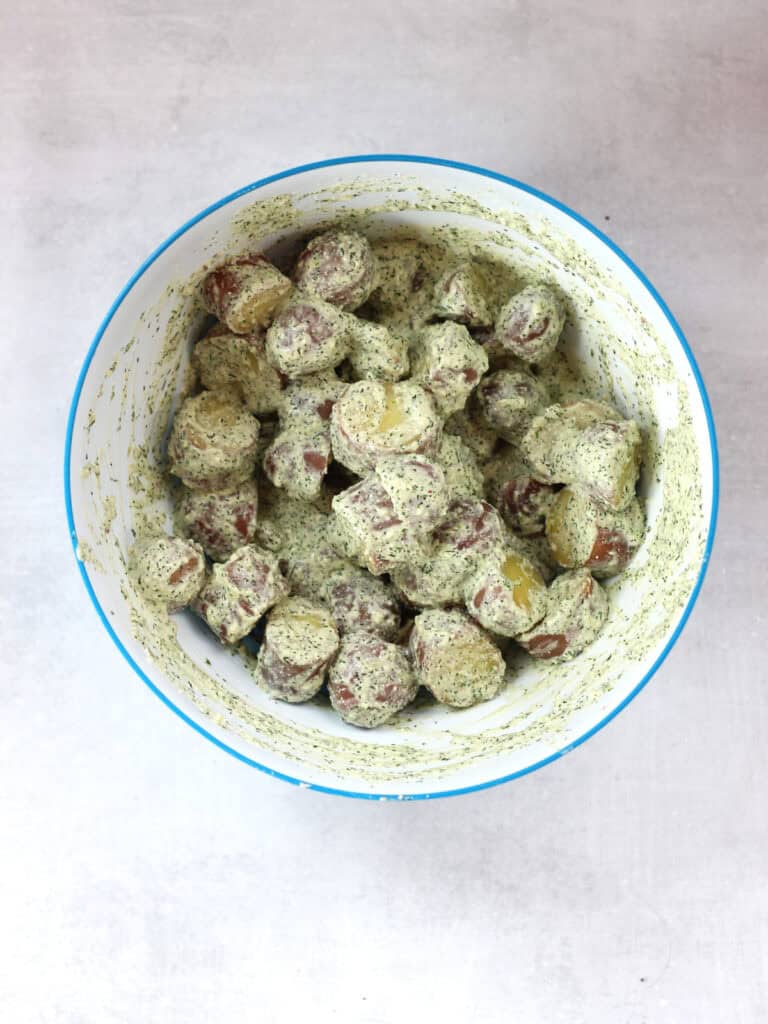 Potatoes tossed in the dressing.