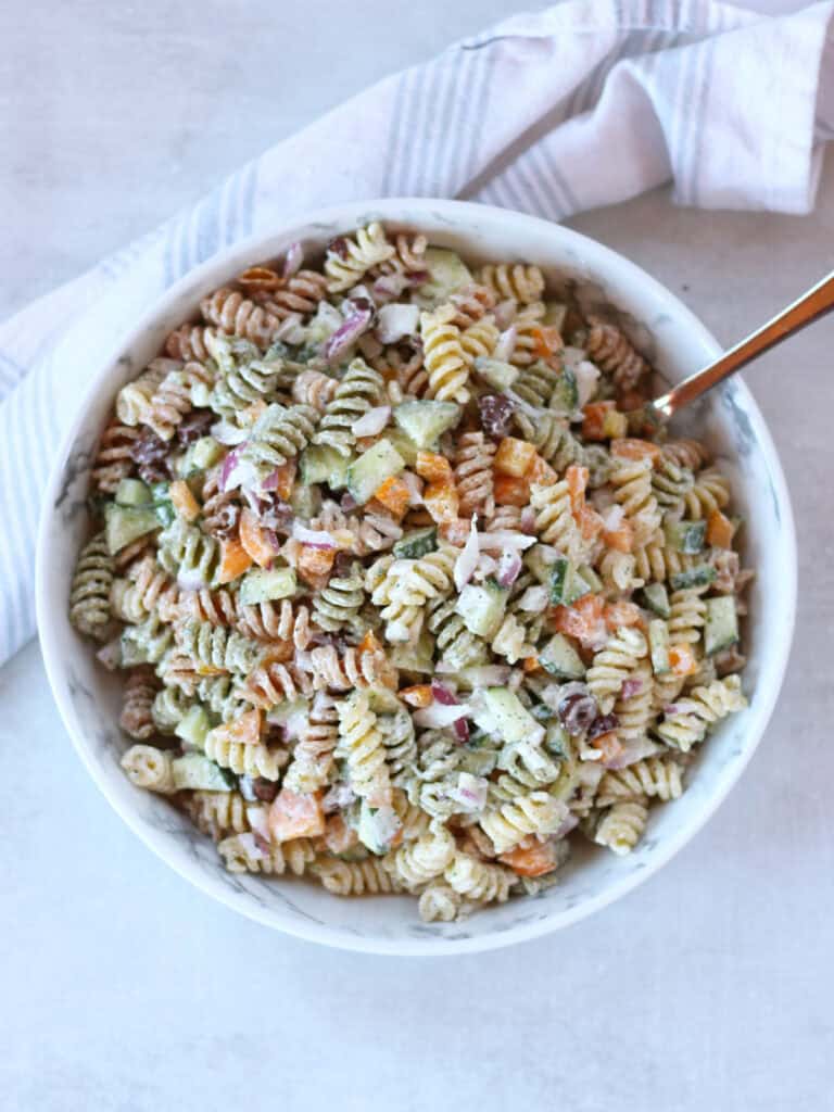 Creamy pasta salad with cottage cheese served in a bowl.