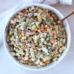 Cottage cheese pasta salad served in a large bowl with a spoon.