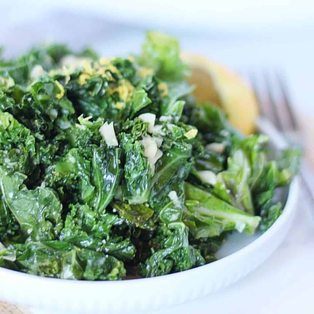 Sauteed kale garnished with lemon zest.