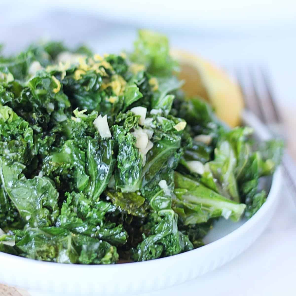 Sauteed kale garnished with lemon zest.