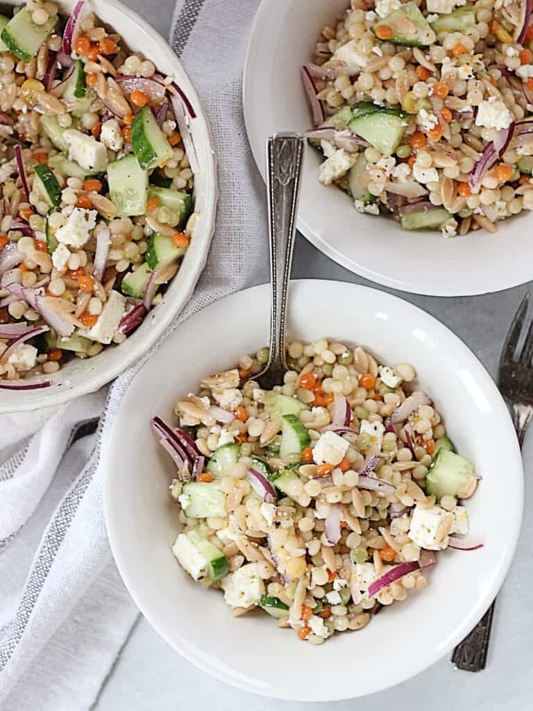 Three bowls of couscous side salad.